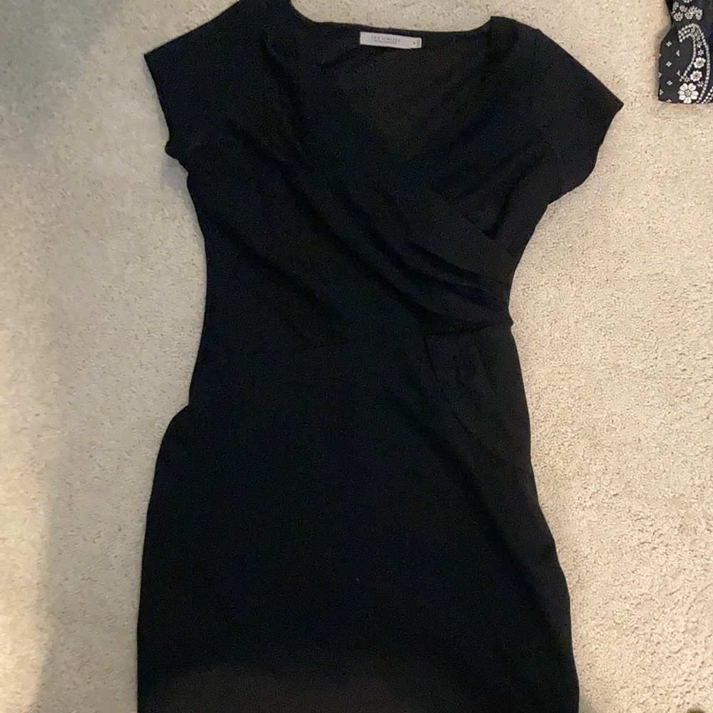 Limited size medium black knit cocktail dress. Does not wrinkle!!